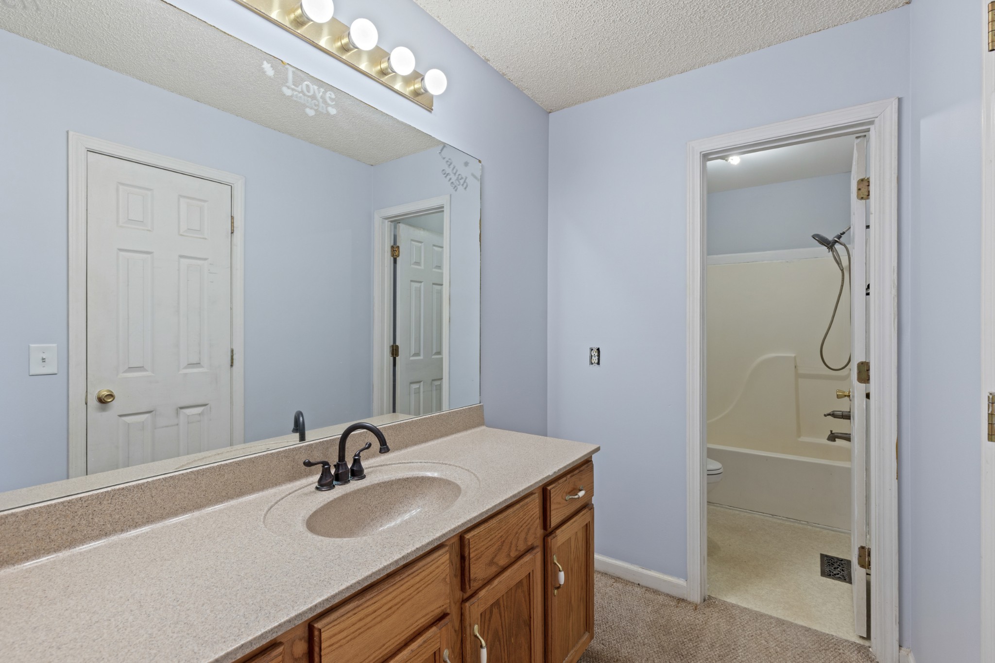 1069 Heatherwood Road Pleasant View, TN 37146 - Photo 24 of 45 a bathroom with a sink and a mirror
