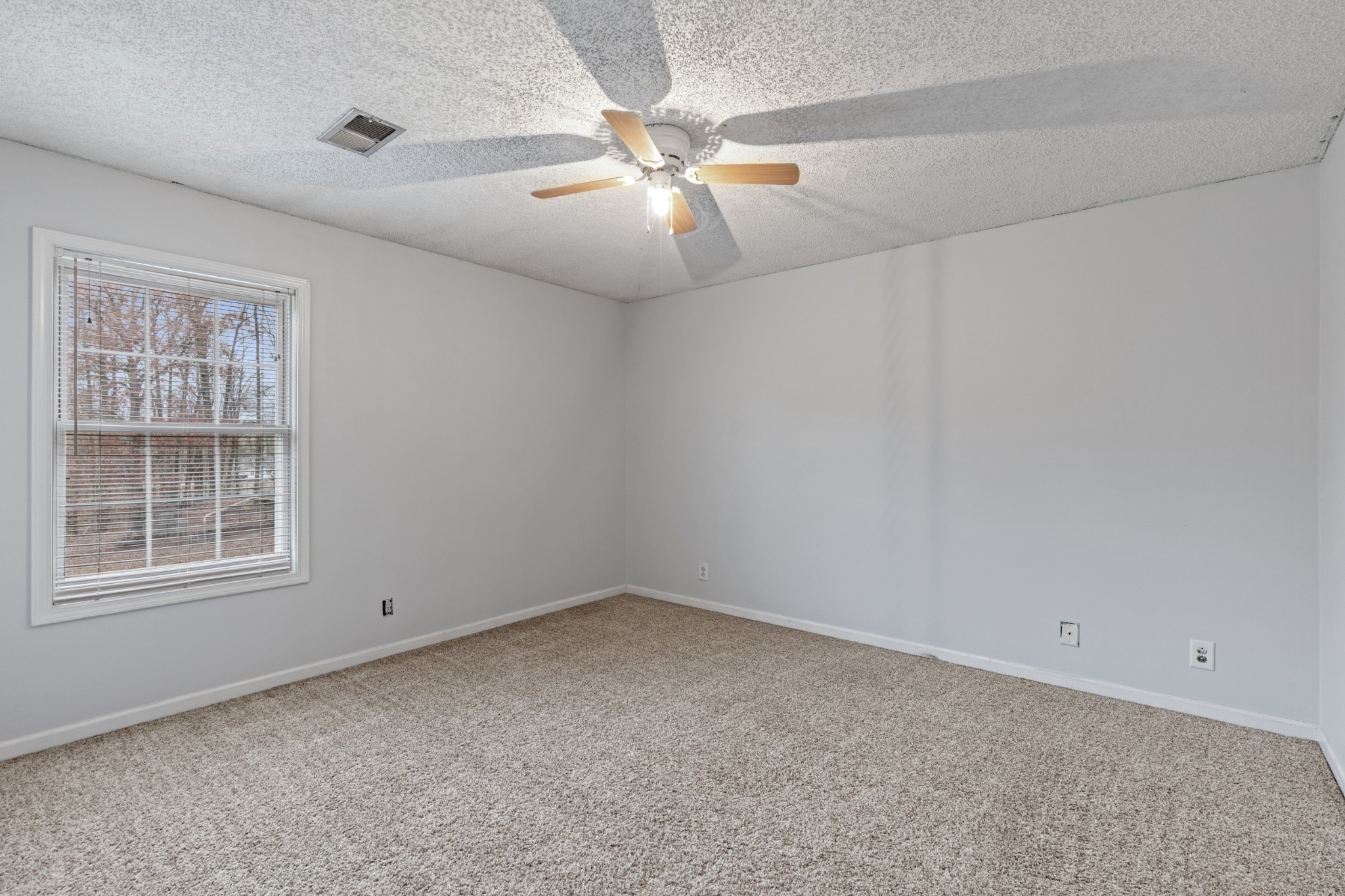 1069 Heatherwood Road Pleasant View, TN 37146 - Photo 27 of 45 an empty room with windows and fan