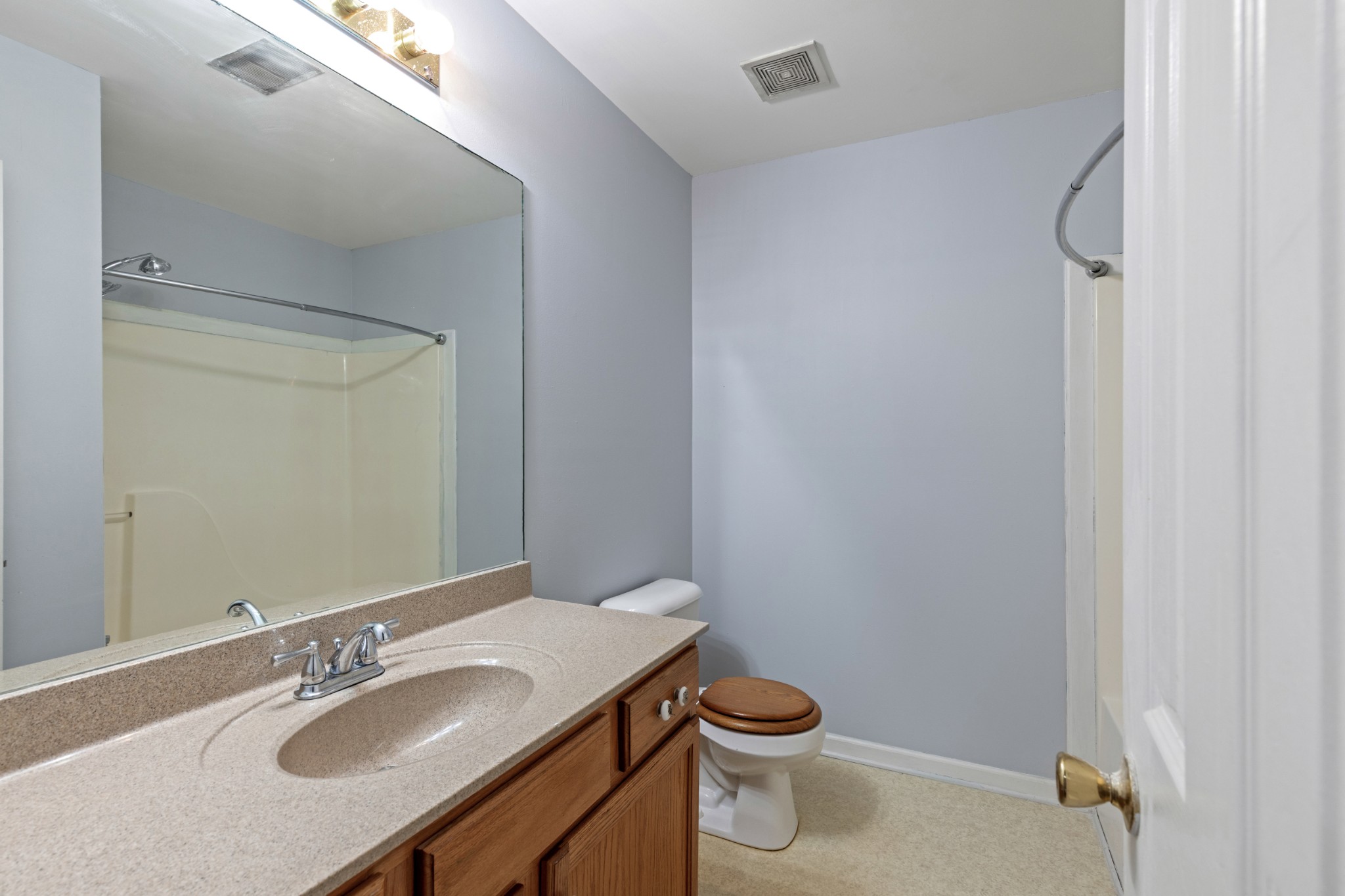 1069 Heatherwood Road Pleasant View, TN 37146 - Photo 30 of 45 a bathroom with a granite countertop sink toilet and a mirror