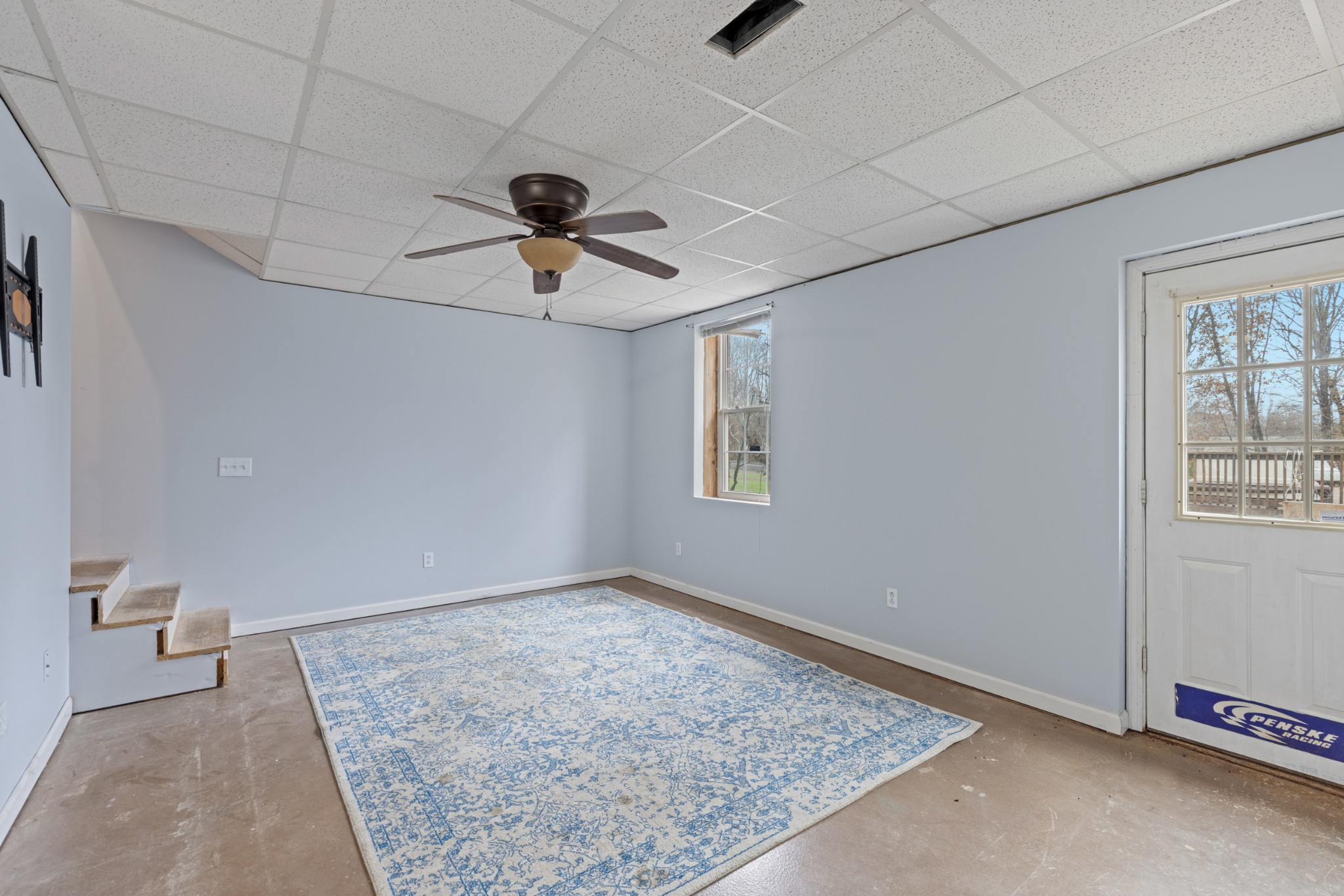 1069 Heatherwood Road Pleasant View, TN 37146 - Photo 35 of 45 a view of a hallway with a chandelier fan and a rug