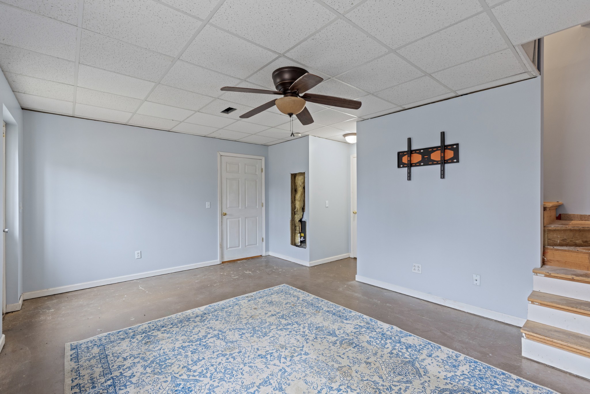 1069 Heatherwood Road Pleasant View, TN 37146 - Photo 37 of 45 a view of a hallway with wooden floor and a ceiling fan