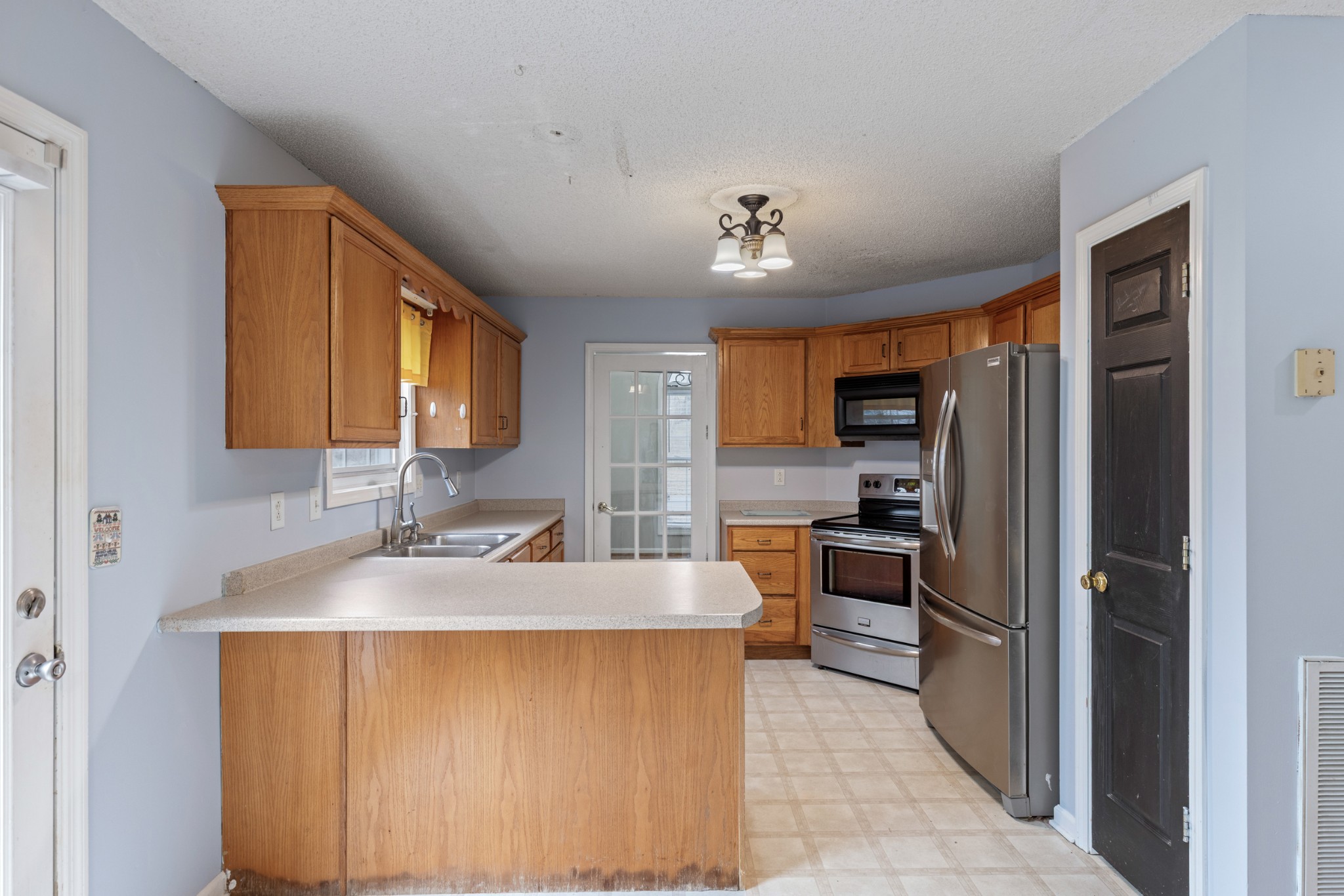 1069 Heatherwood Road Pleasant View, TN 37146 - Photo 9 of 45 a large kitchen with kitchen island granite countertop a large counter top stainless steel appliances and cabinets