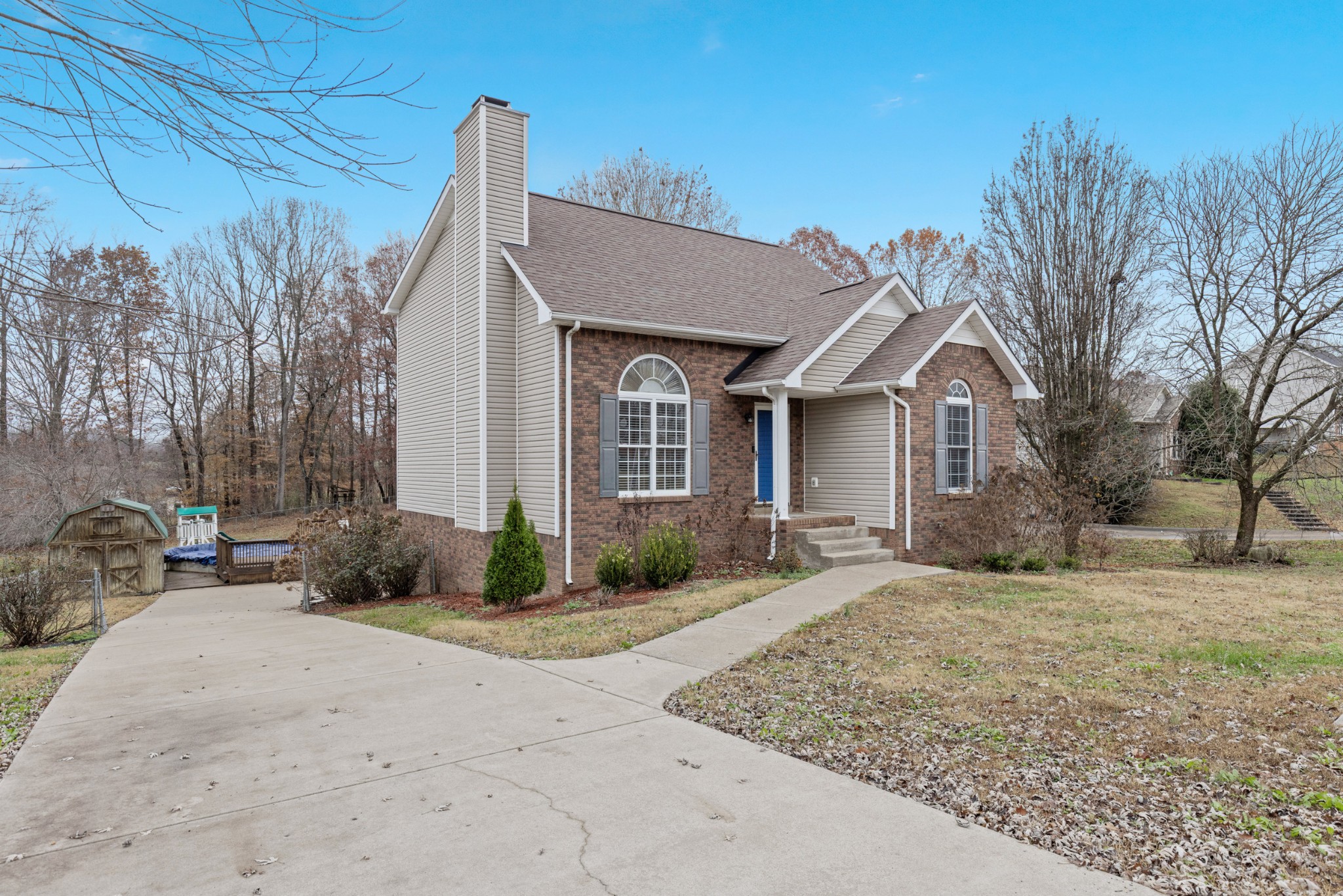 1069 Heatherwood Road Pleasant View, TN 37146 - Photo 10 of 45 a front view of a house with garden