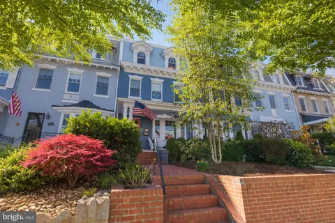a front view of a multi story residential apartment buildings