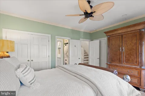 a bedroom with a bed and hallway