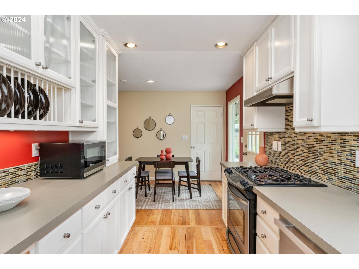 12250 Southwest Tremont Street Portland, OR 97225 - Photo 19 of 38 a kitchen with stainless steel appliances granite countertop a stove and a sink