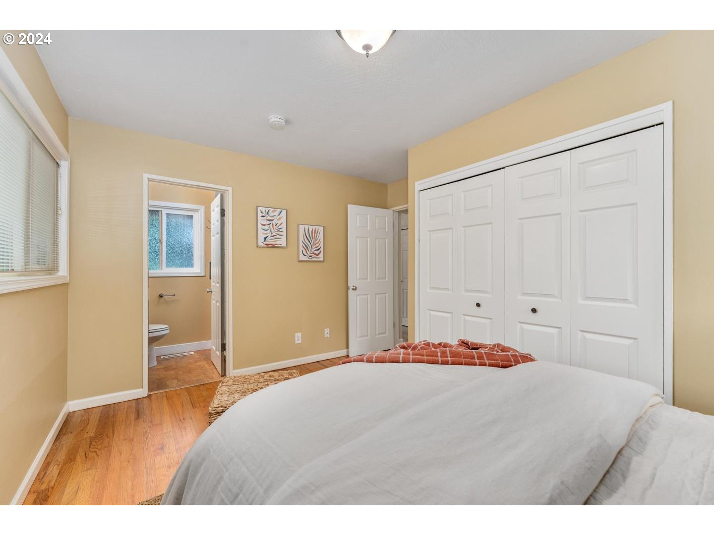 12250 Southwest Tremont Street Portland, OR 97225 - Photo 22 of 38 a bedroom with a bed and a lamp