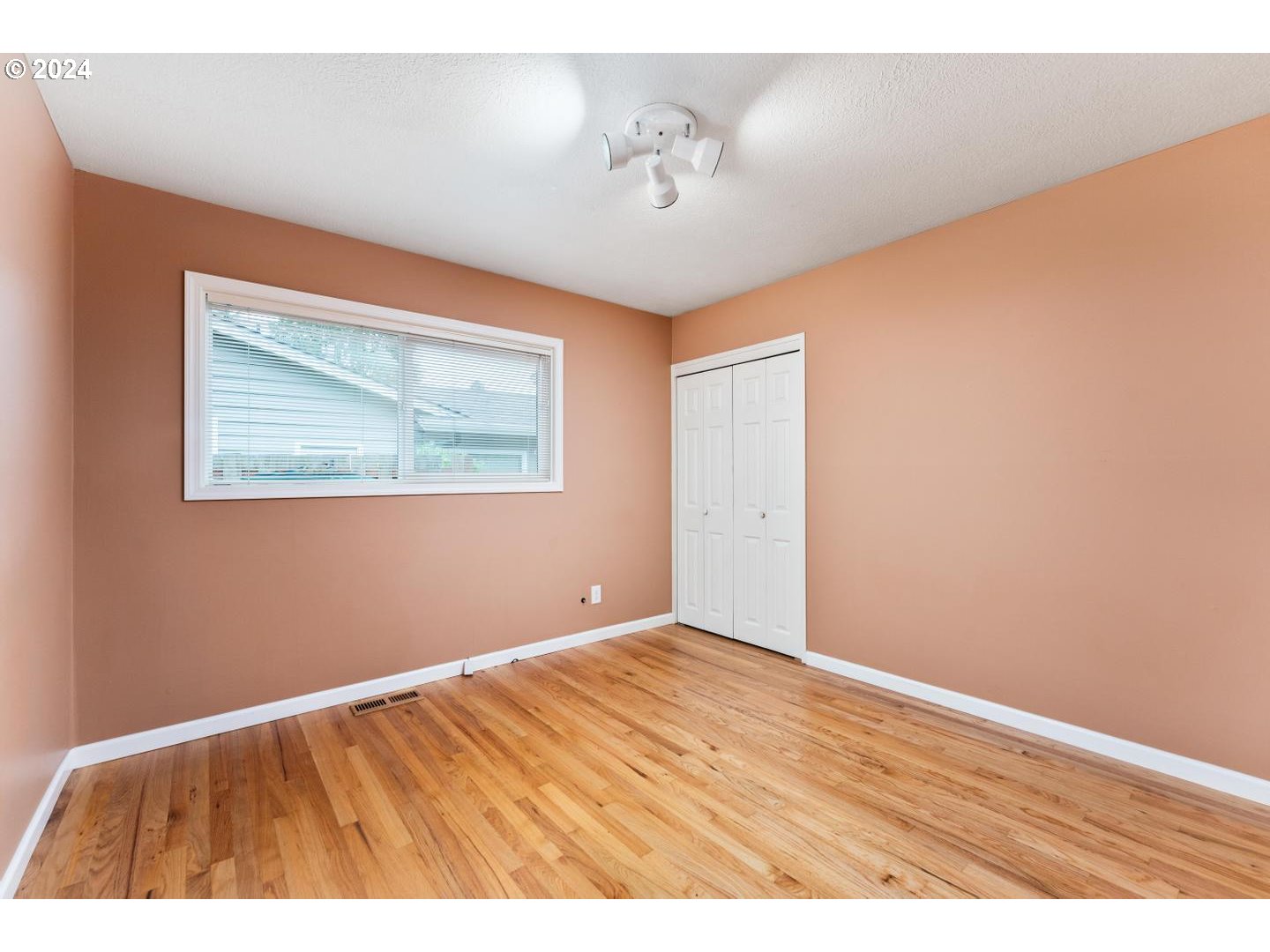 12250 Southwest Tremont Street Portland, OR 97225 - Photo 27 of 38 a view of an empty room with wooden floor