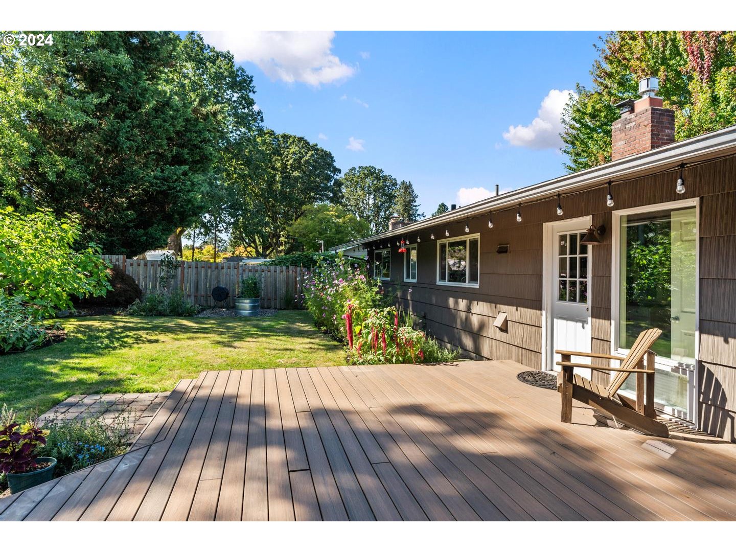 12250 Southwest Tremont Street Portland, OR 97225 - Photo 32 of 38 a view of a house with backyard and sitting area
