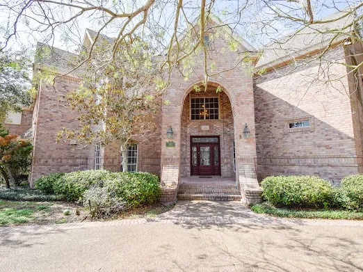 a front view of a house with yard