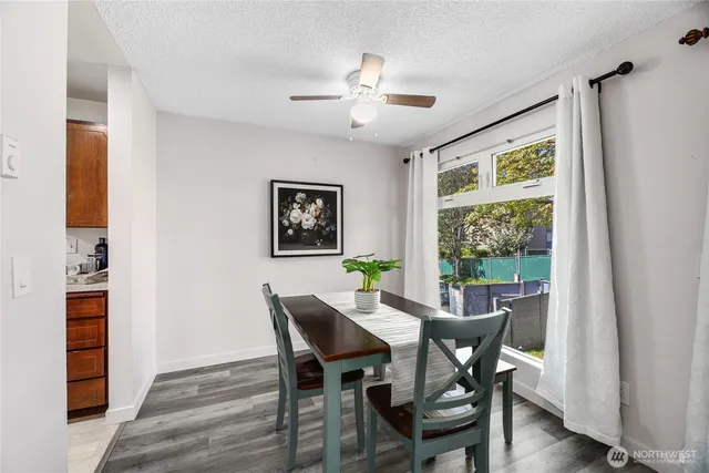 a view of a dining room with furniture and wooden floor