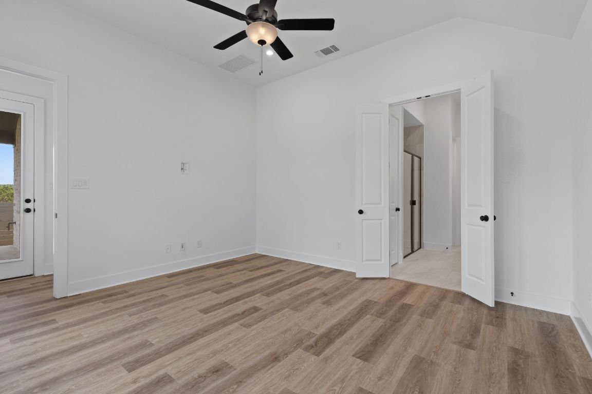 425 Hickory Springs Trail Georgetown, TX 78628 - Photo 18 of 35 Primary Bedroom with elevated ceiling