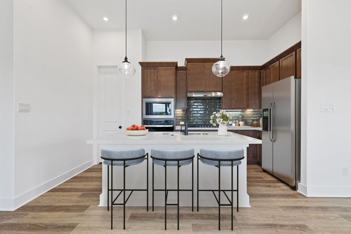425 Hickory Springs Trail Georgetown, TX 78628 - Photo 3 of 35 Light & Bright Kitchen - Virtually Staged