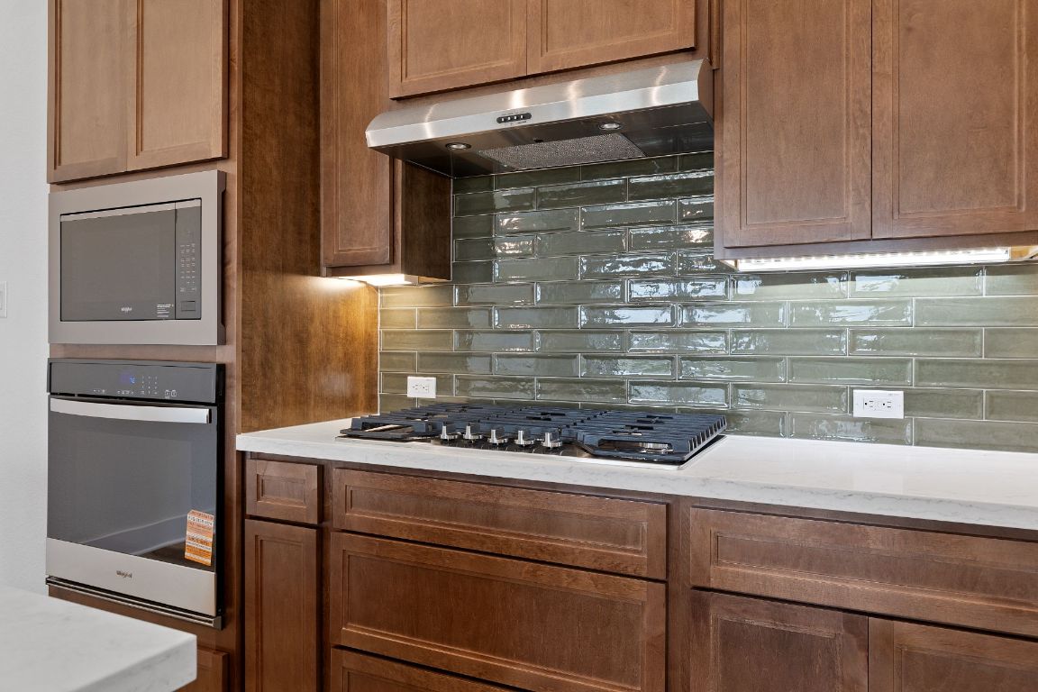 425 Hickory Springs Trail Georgetown, TX 78628 - Photo 9 of 35 Stunning finishes in Light & Bright Kitchen