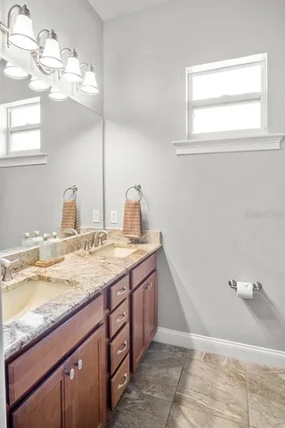 a bedroom with a bed and a table in it