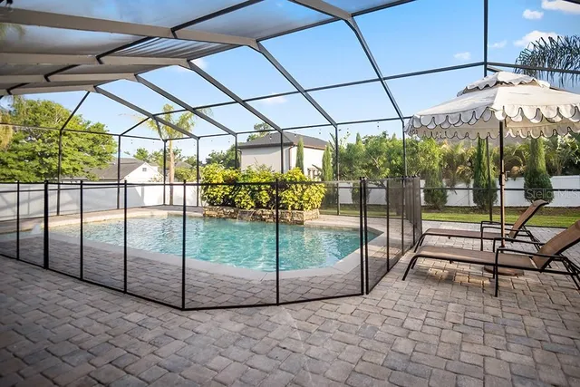 a view of a backyard with sitting area and furniture