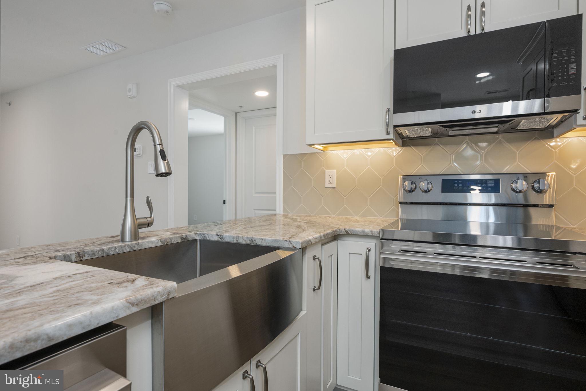 2185 Kimberton Road, Unit 5 Phoenixville, PA 19460 - Photo 11 of 36 a kitchen with a stove and a sink