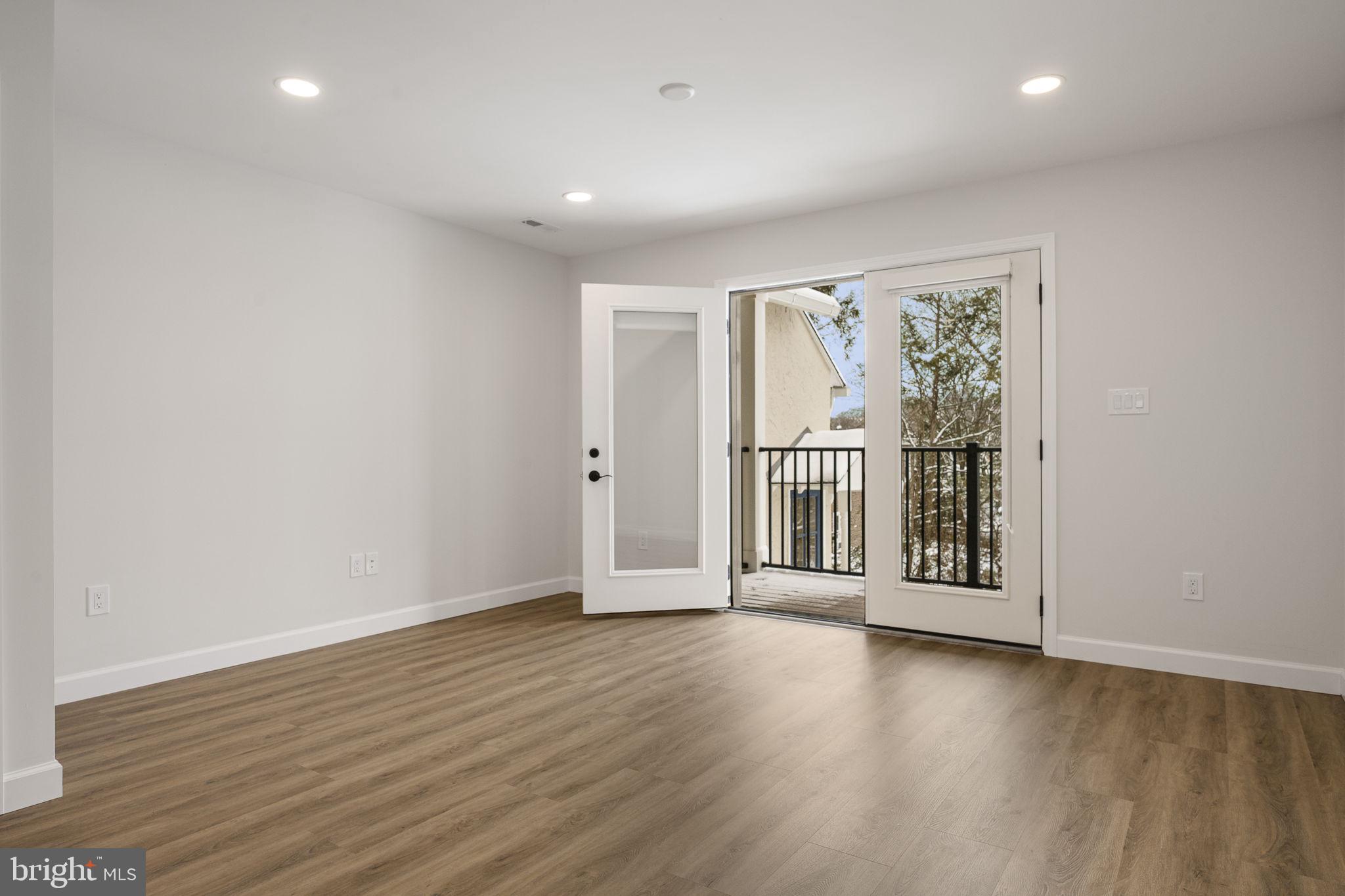 2185 Kimberton Road, Unit 5 Phoenixville, PA 19460 - Photo 13 of 36 an empty room with wooden floor and windows