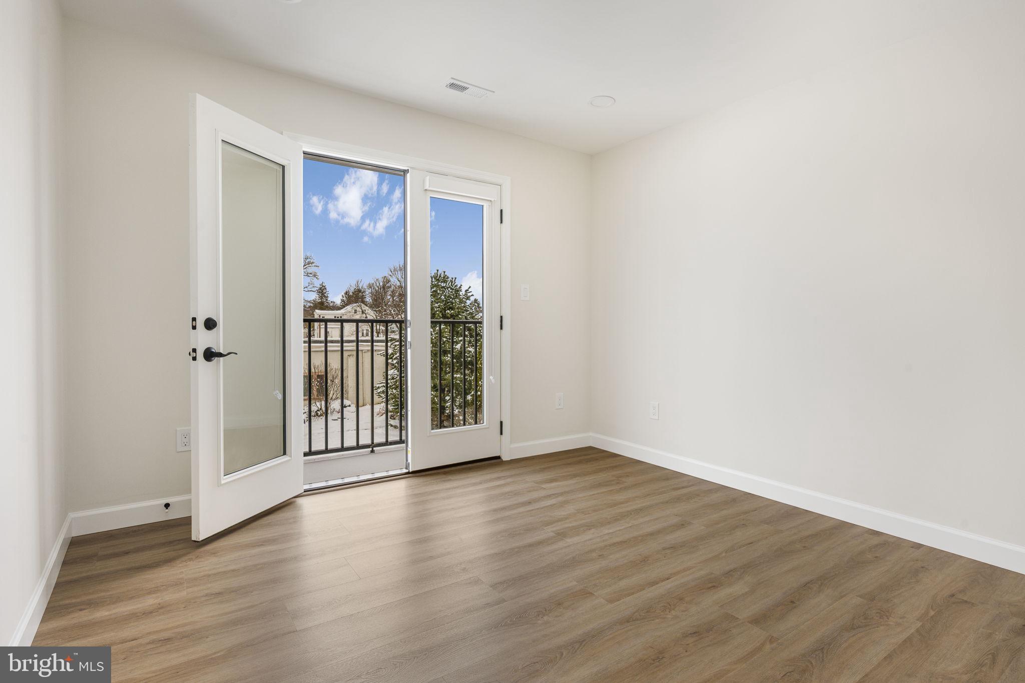 2185 Kimberton Road, Unit 5 Phoenixville, PA 19460 - Photo 18 of 36 a view of a big room with wooden floor and windows