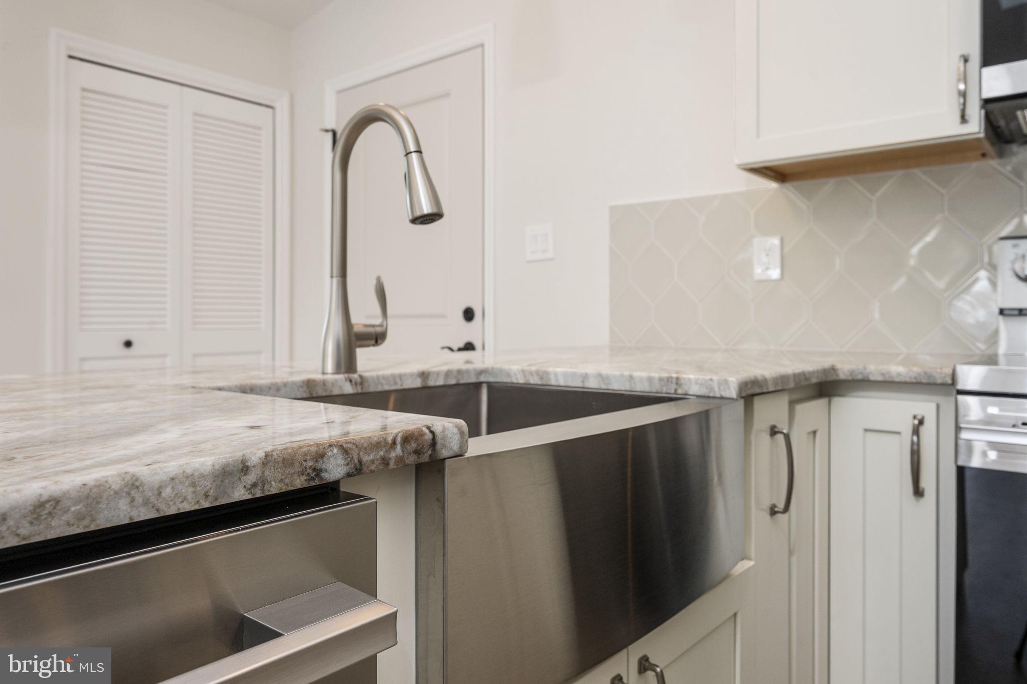 2185 Kimberton Road, Unit 5 Phoenixville, PA 19460 - Photo 21 of 36 a bathroom with a granite countertop sink and a mirror