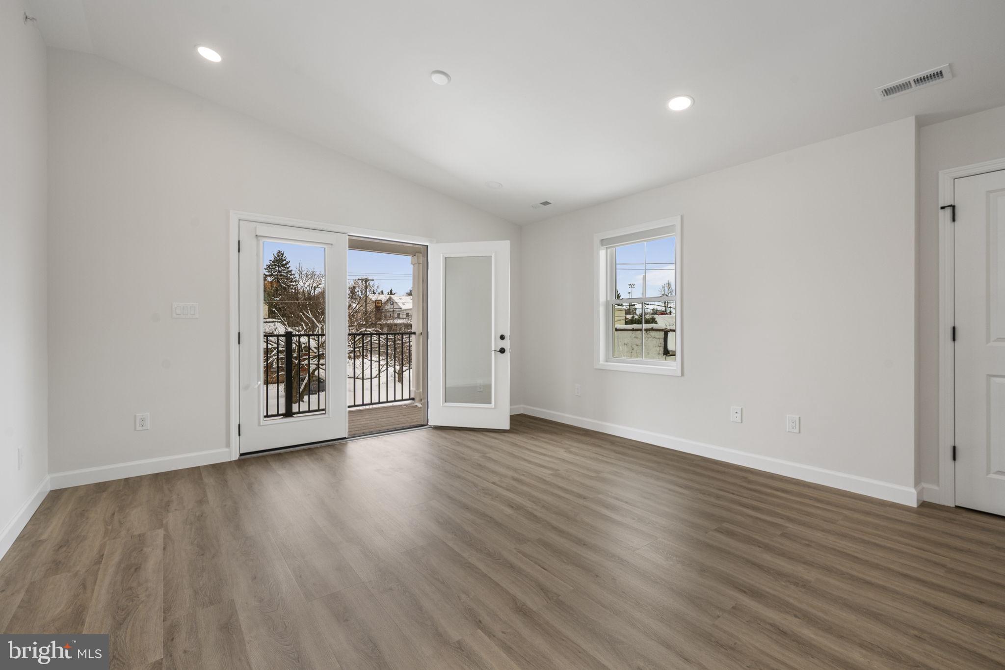 2185 Kimberton Road, Unit 5 Phoenixville, PA 19460 - Photo 23 of 36 a view of an empty room with wooden floor and a window