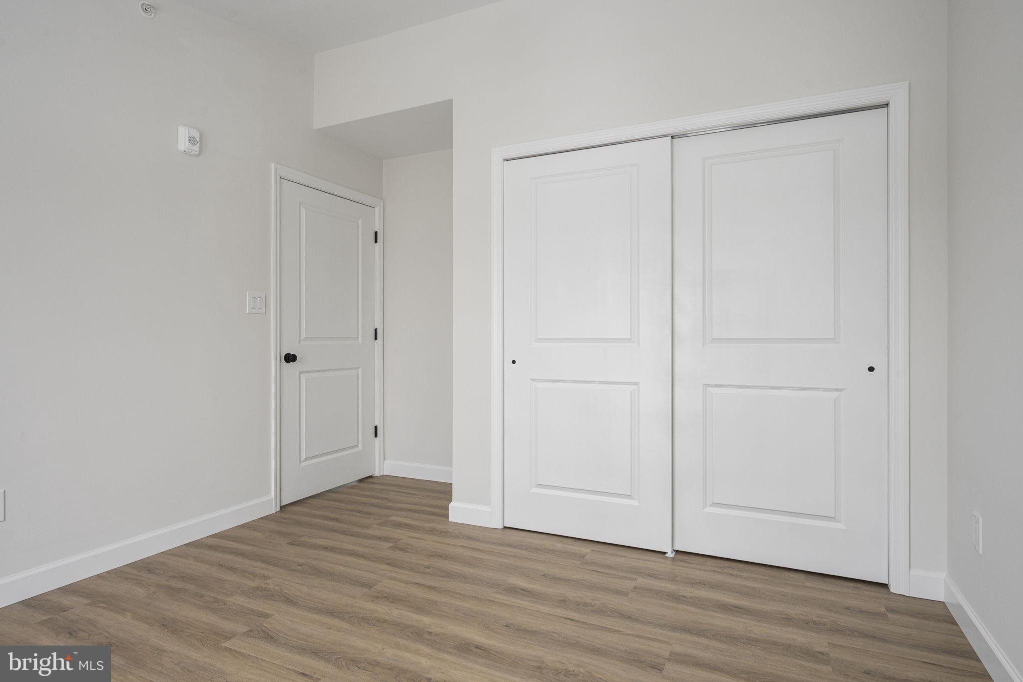 2185 Kimberton Road, Unit 5 Phoenixville, PA 19460 - Photo 25 of 36 a view of an empty room with wooden floor