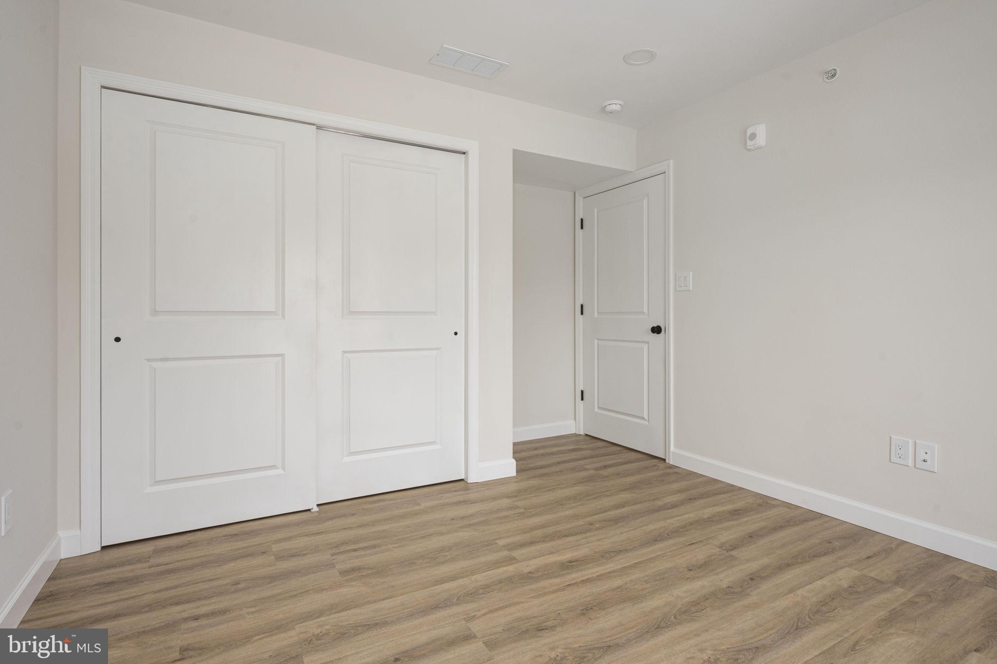 2185 Kimberton Road, Unit 5 Phoenixville, PA 19460 - Photo 29 of 36 a view of an empty room with wooden floor