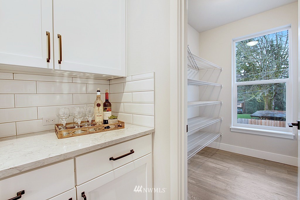 17718 Clover Road Bothell, WA 98012 - Photo 12 of 24 a bathroom with a sink and a window