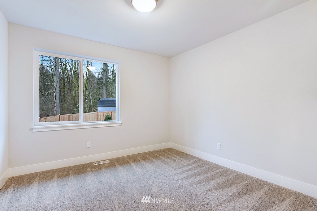 17718 Clover Road Bothell, WA 98012 - Photo 18 of 24 an empty room with a window