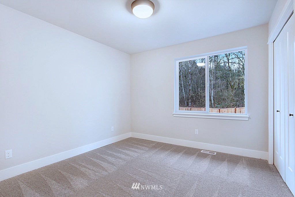 17718 Clover Road Bothell, WA 98012 - Photo 19 of 24 an empty room with a window
