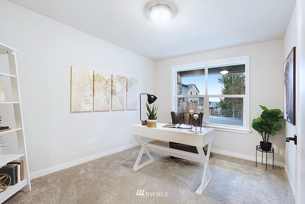 17718 Clover Road Bothell, WA 98012 - Photo 22 of 24 a living room with furniture and a potted plant