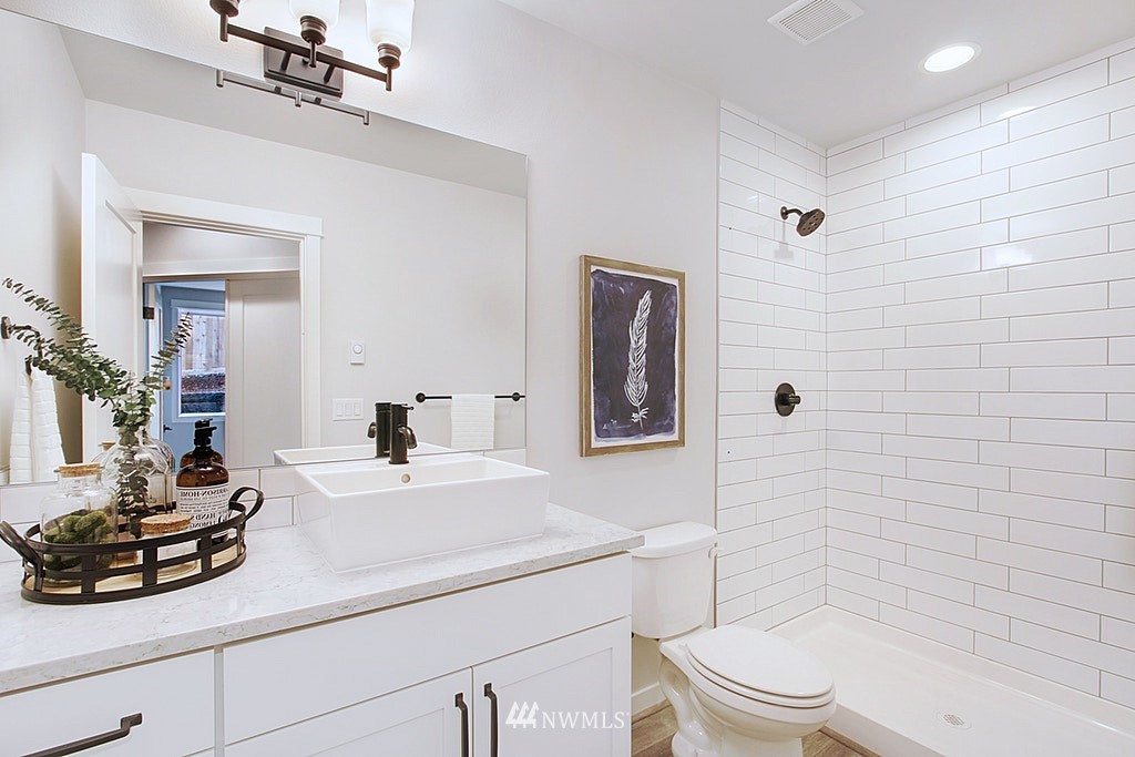 17718 Clover Road Bothell, WA 98012 - Photo 23 of 24 a bathroom with a sink a toilet and shower