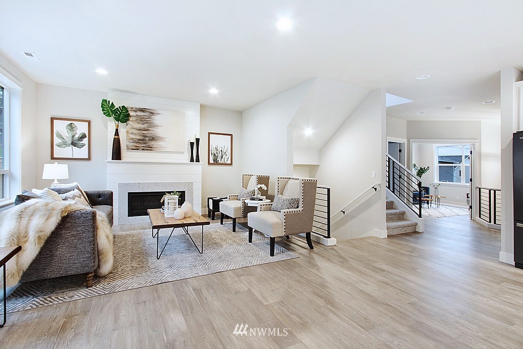 17718 Clover Road Bothell, WA 98012 - Photo 6 of 24 a living room with furniture and a fireplace