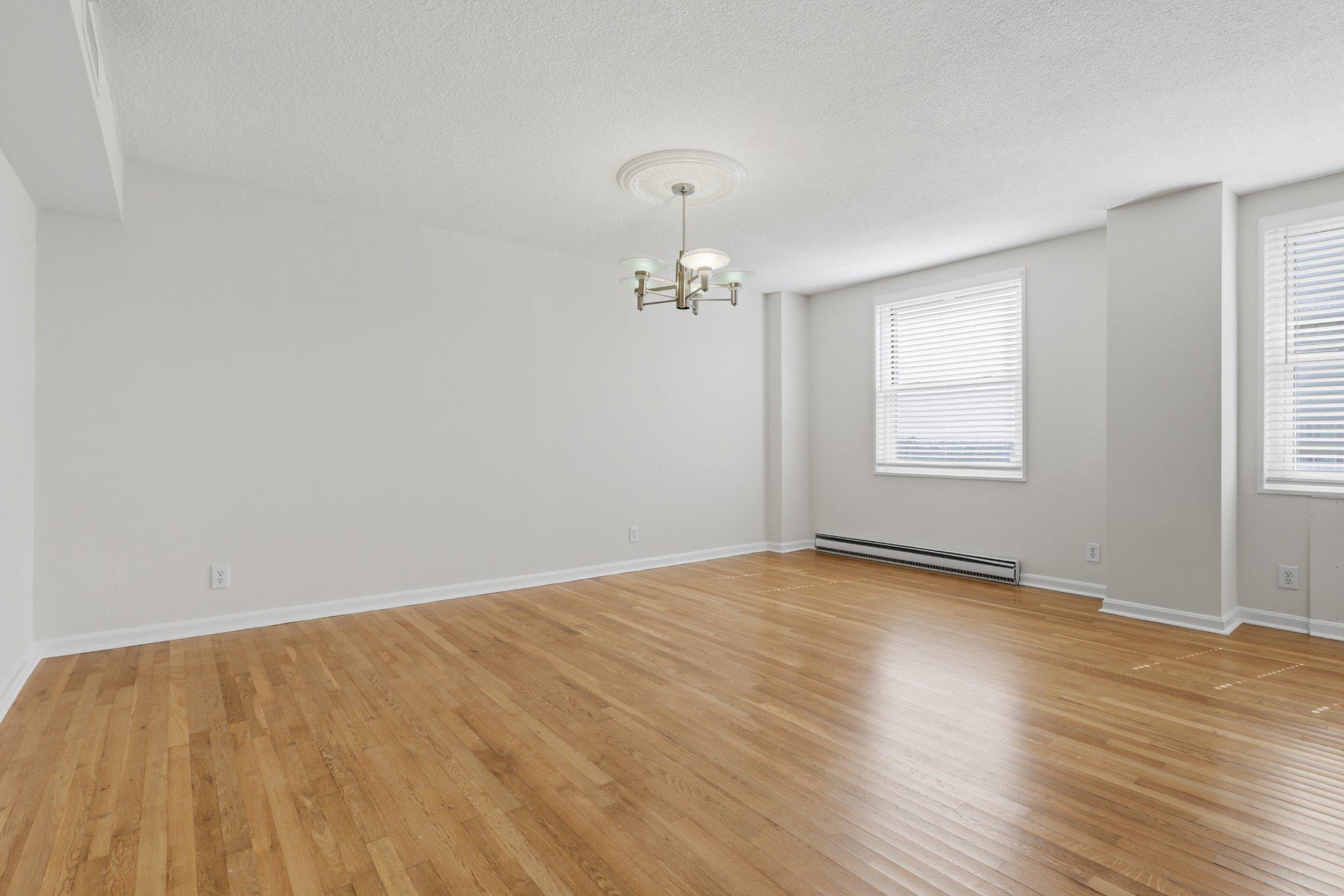 1101 St Paul Street, Unit 1212 Baltimore, MD 21202 - Photo 18 of 36 Spacious, sunlit open living/dining area.