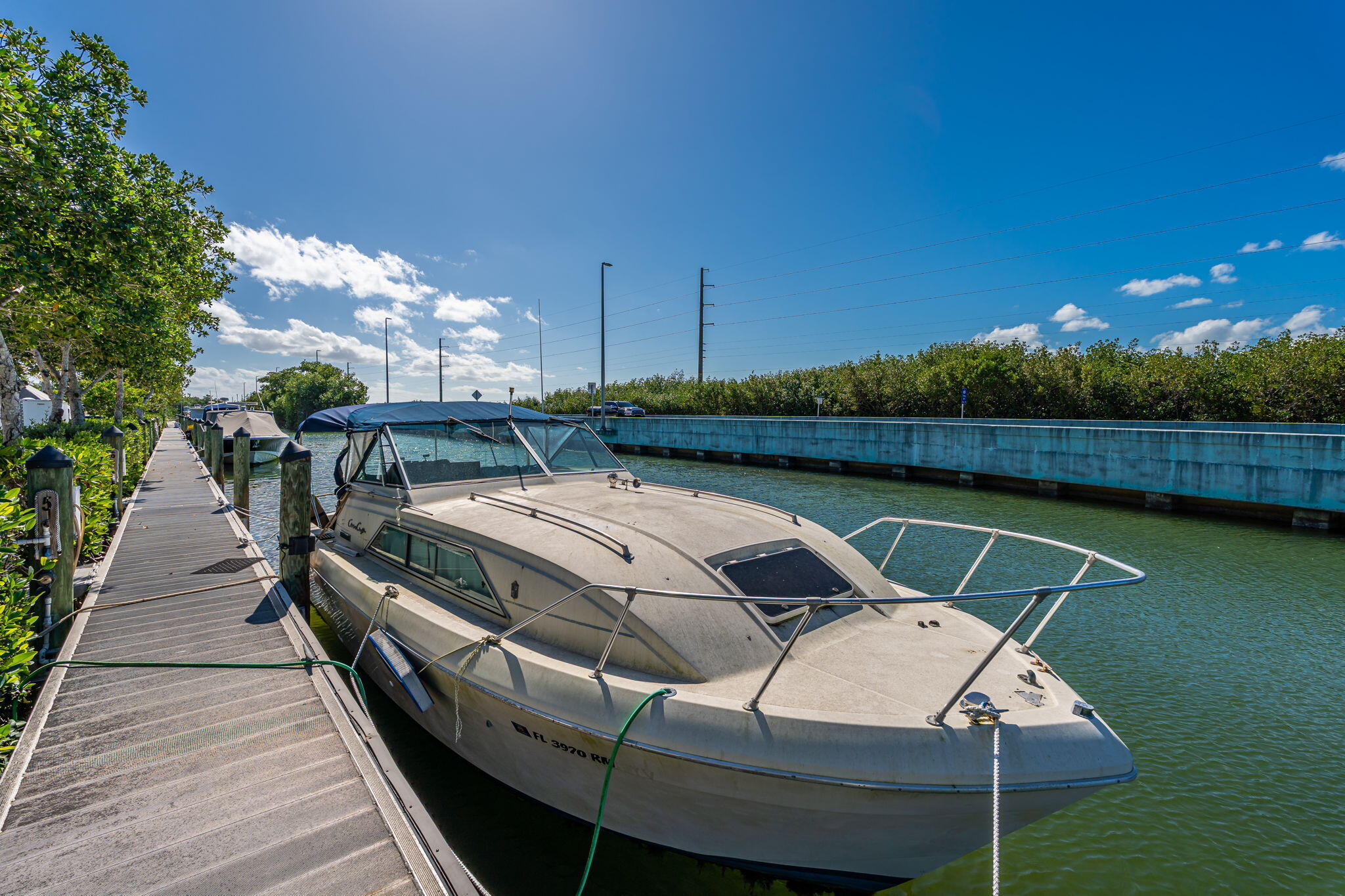 100 Morris Lane Key Largo, FL 33037 - Photo 125 of 192 a view of swimming pool with seating area and trees in the background