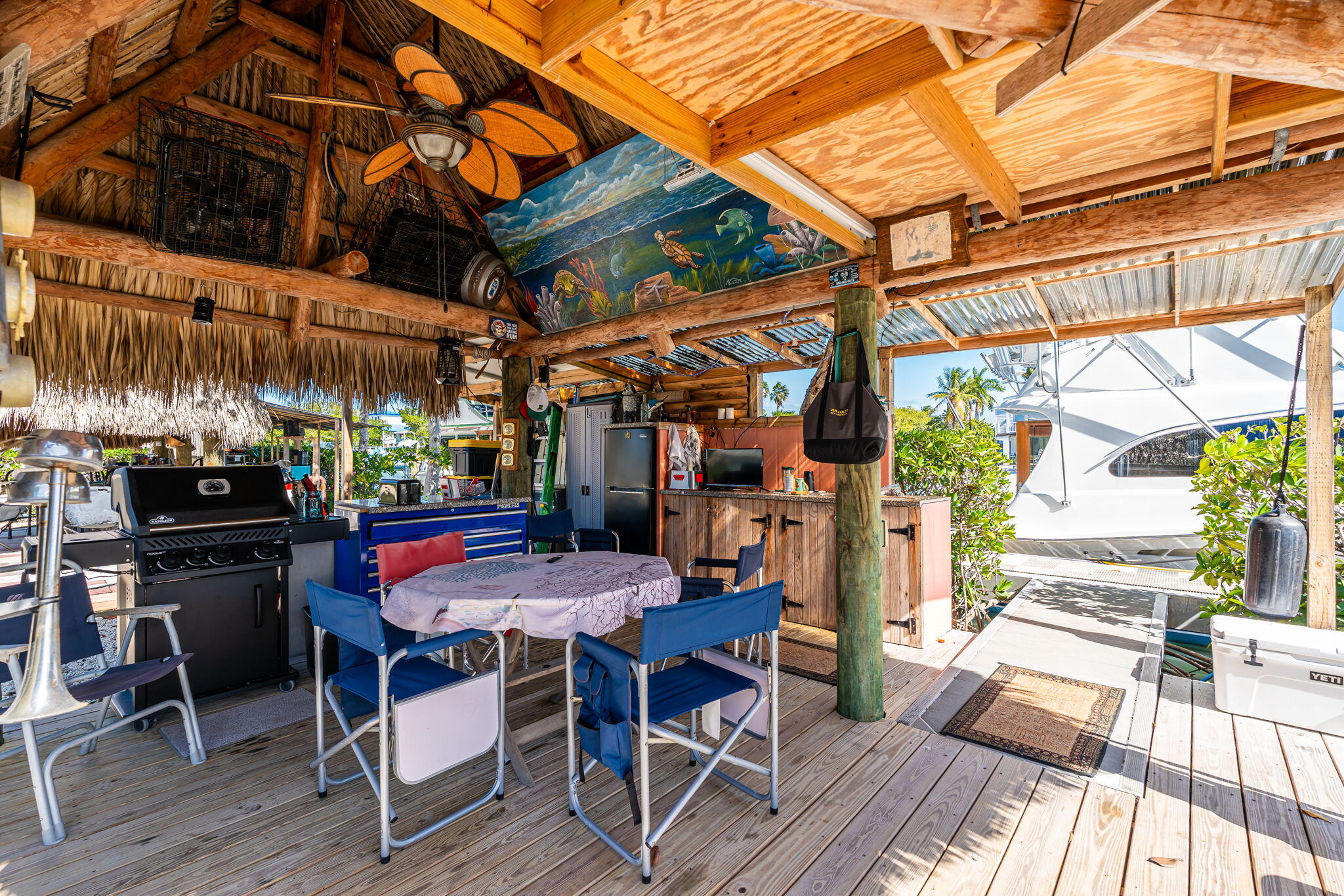 100 Morris Lane Key Largo, FL 33037 - Photo 138 of 192 a view of a chairs and table in patio with a barbeque