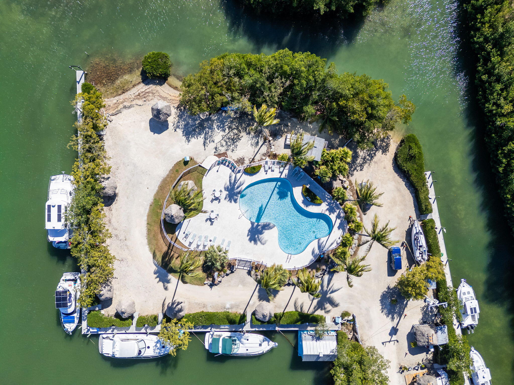 100 Morris Lane Key Largo, FL 33037 - Photo 2 of 192 an aerial view of a house with yard swimming pool and outdoor seating