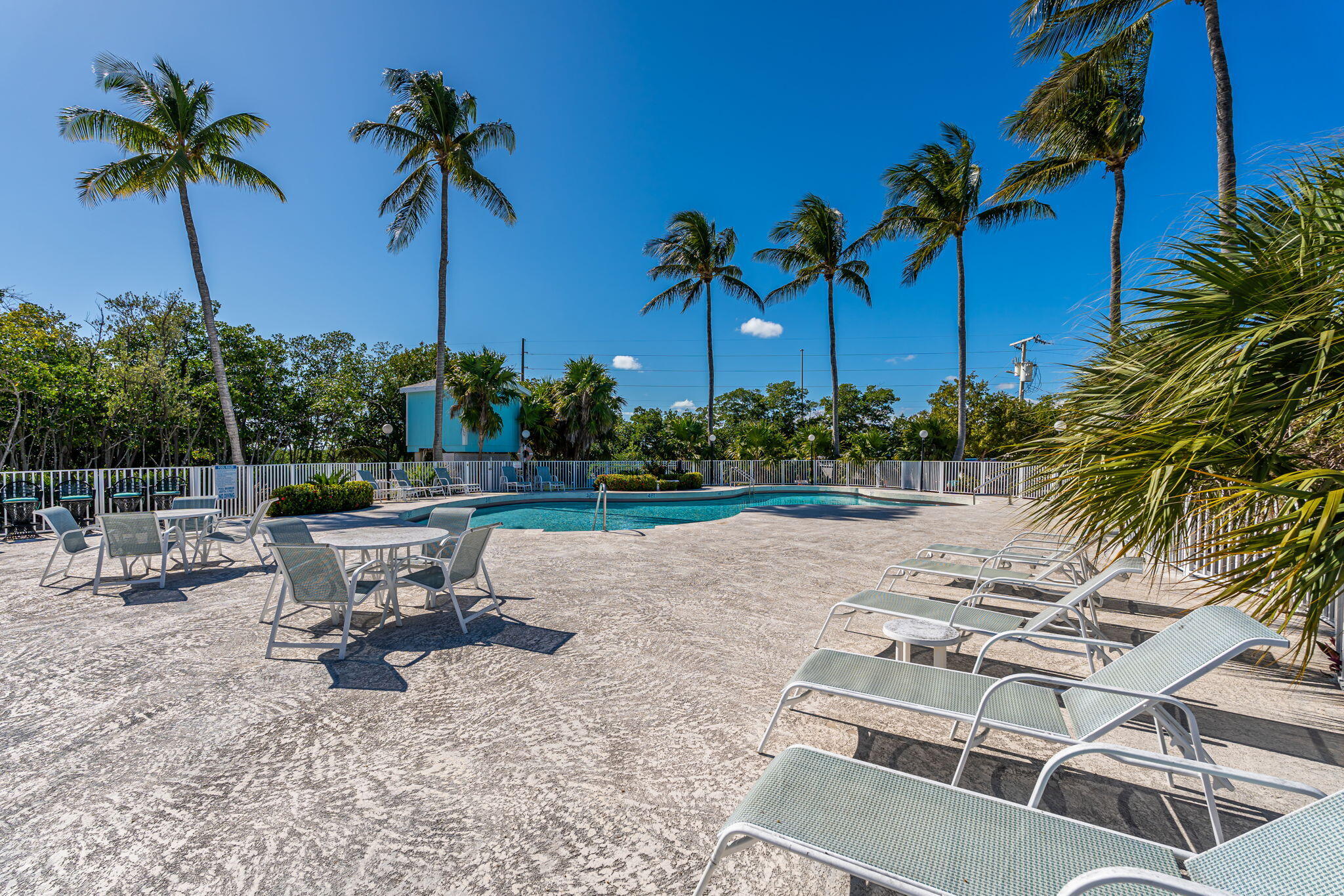 100 Morris Lane, Unit 56 SLIPS Key Largo, FL 33037 - Photo 55 of 56 a view of a yard with a table and chairs
