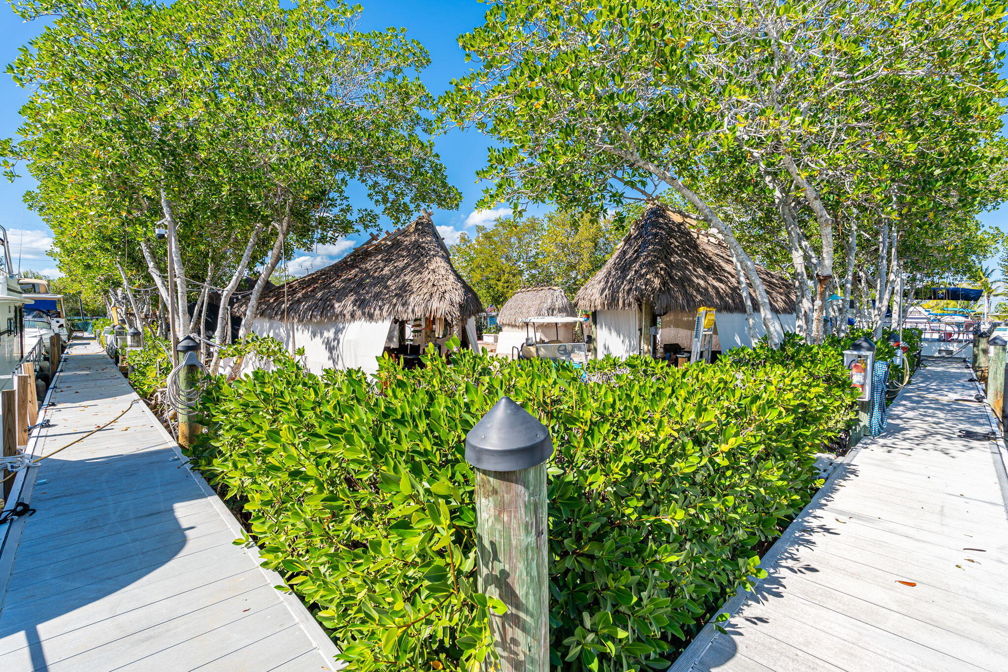 100 Morris Lane Key Largo, FL 33037 - Photo 100 of 192 a front view of a house with a yard and fountain