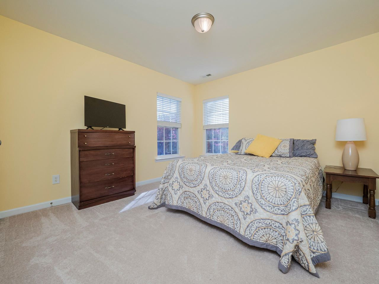 8429 Whisper Ridge Place Raleigh, NC 27613 - Photo 19 of 27 Each of the additional bedrooms easily acommodate a queen sized bed! Secondary bedroom