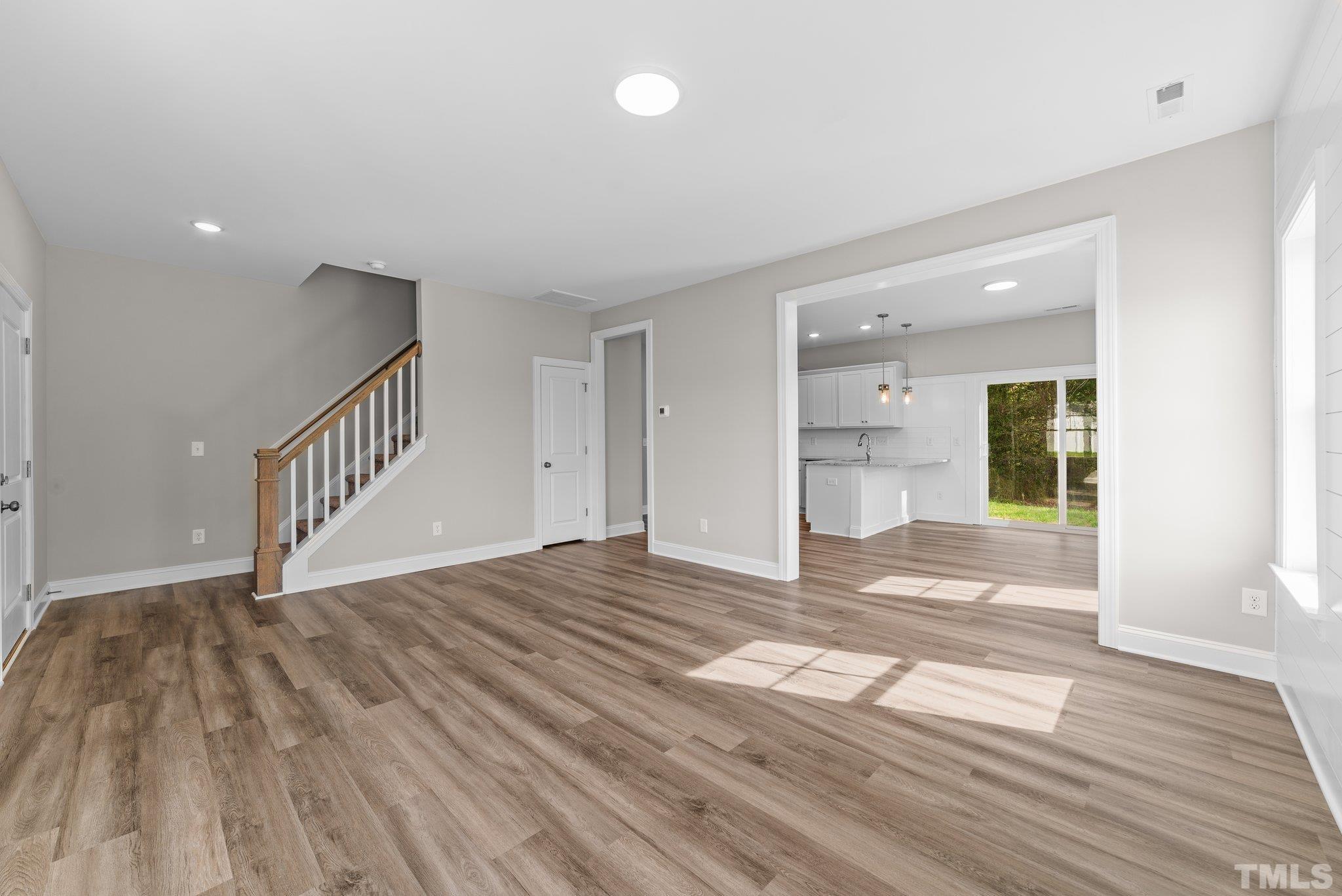 4530 Fairhaven Drive Wilson, NC 27893 - Photo 13 of 49 a view of an empty room and wooden floor