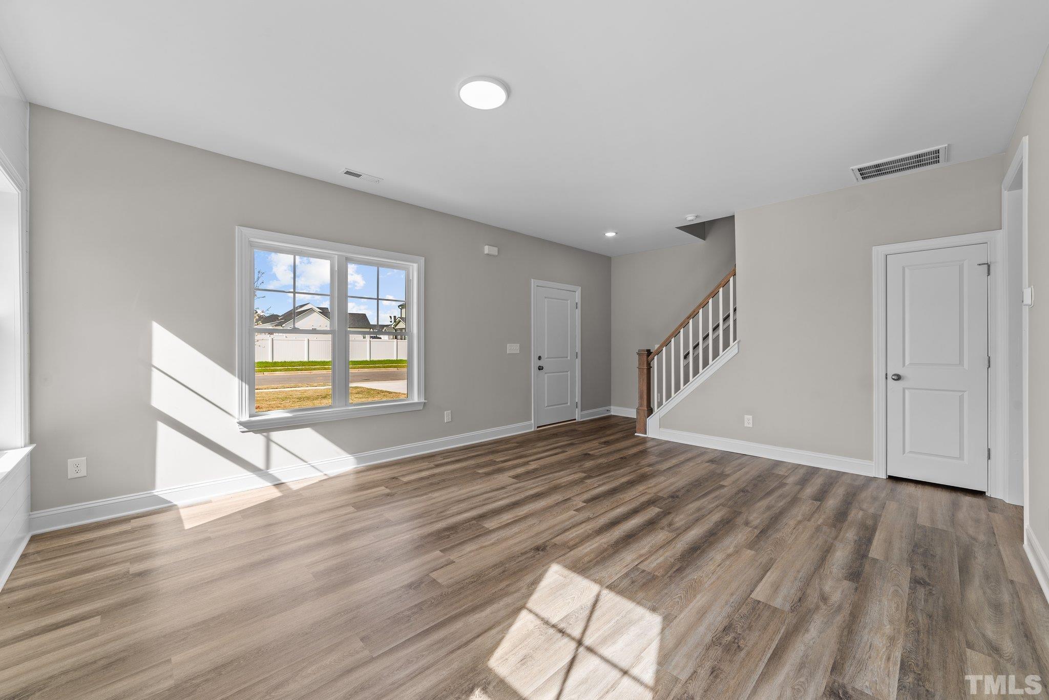 4530 Fairhaven Drive Wilson, NC 27893 - Photo 14 of 49 a view of empty room with wooden floor and fan