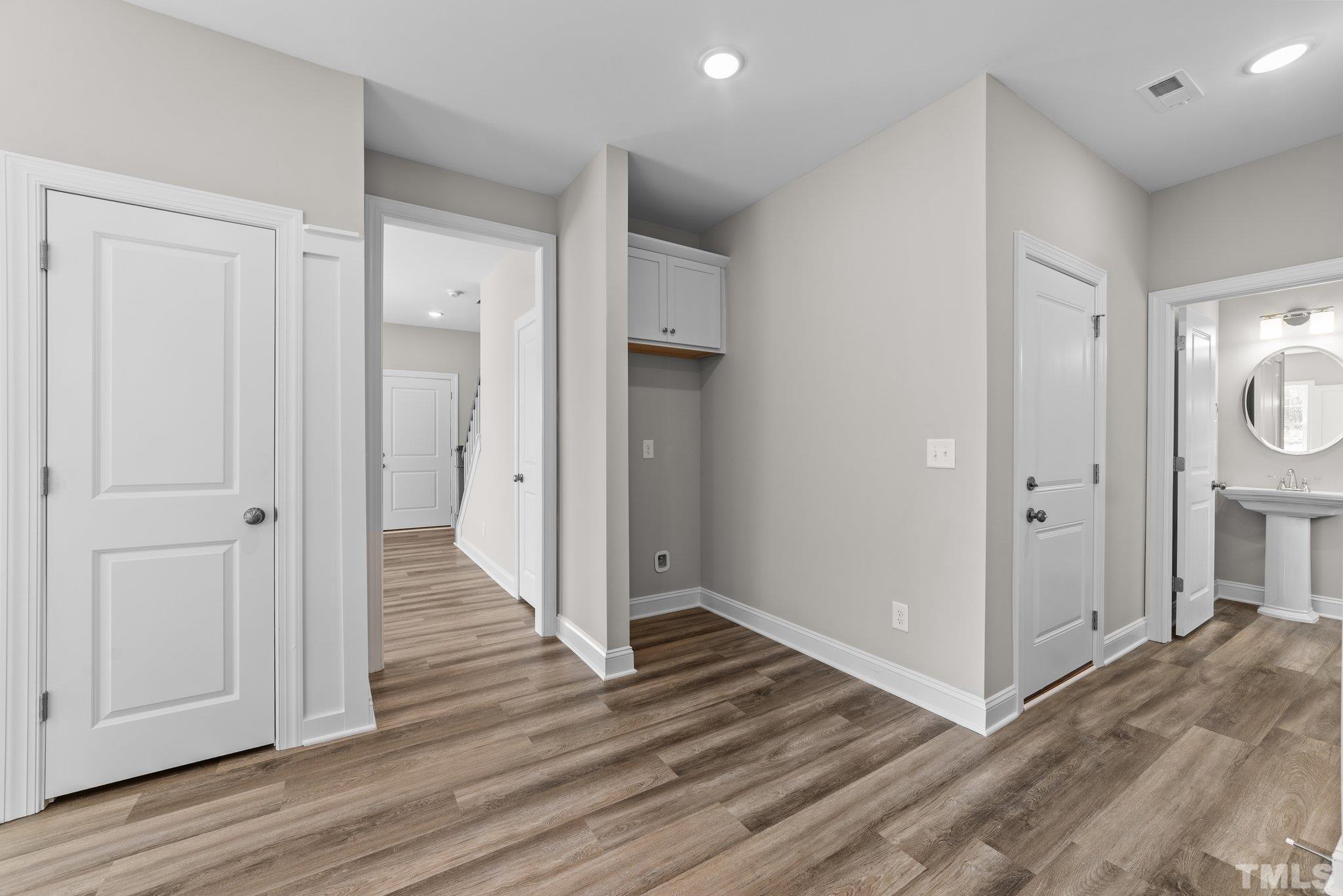 4530 Fairhaven Drive Wilson, NC 27893 - Photo 16 of 49 a view of a hallway with wooden floor