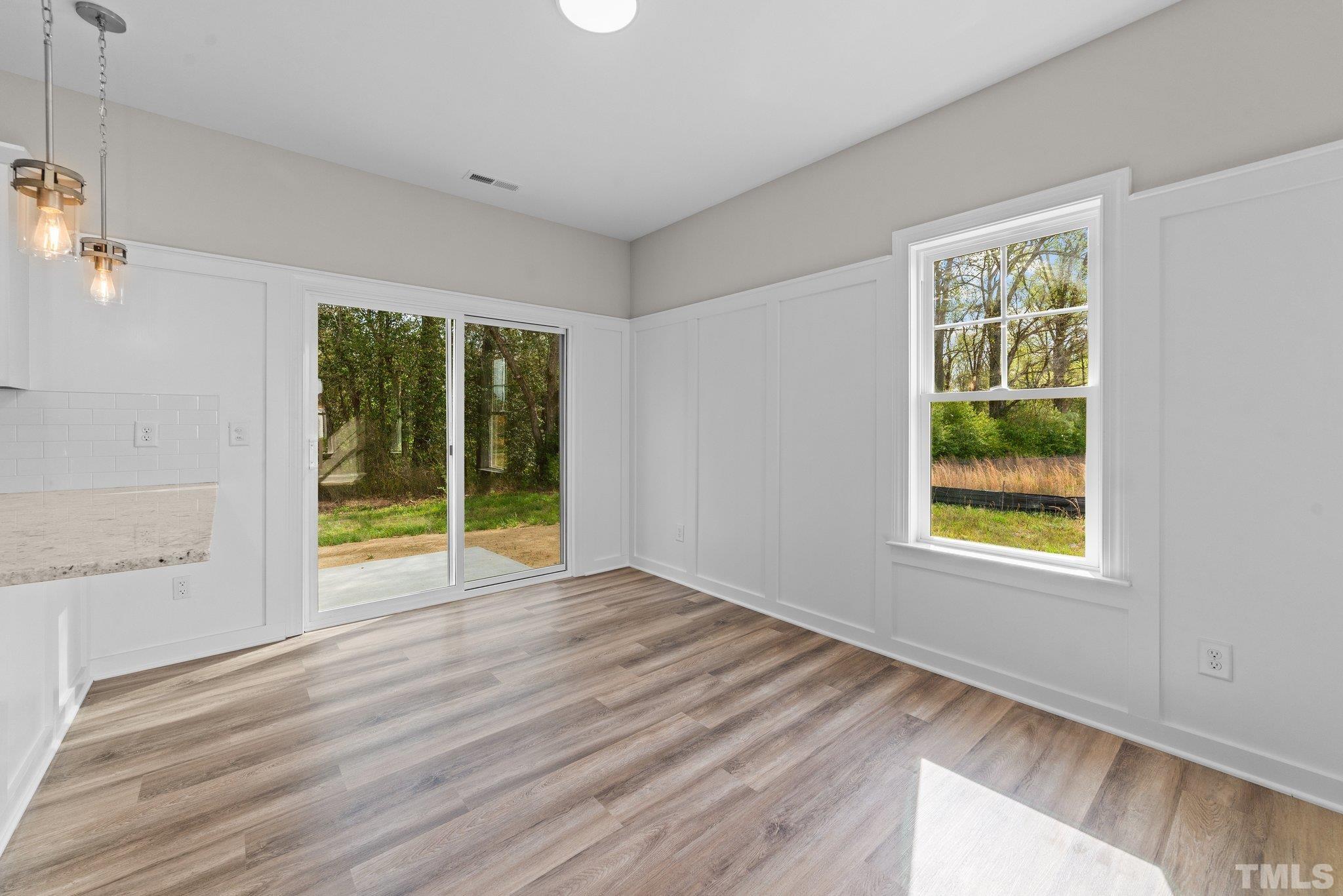 4530 Fairhaven Drive Wilson, NC 27893 - Photo 17 of 49 a view of an empty room with wooden floor and a window