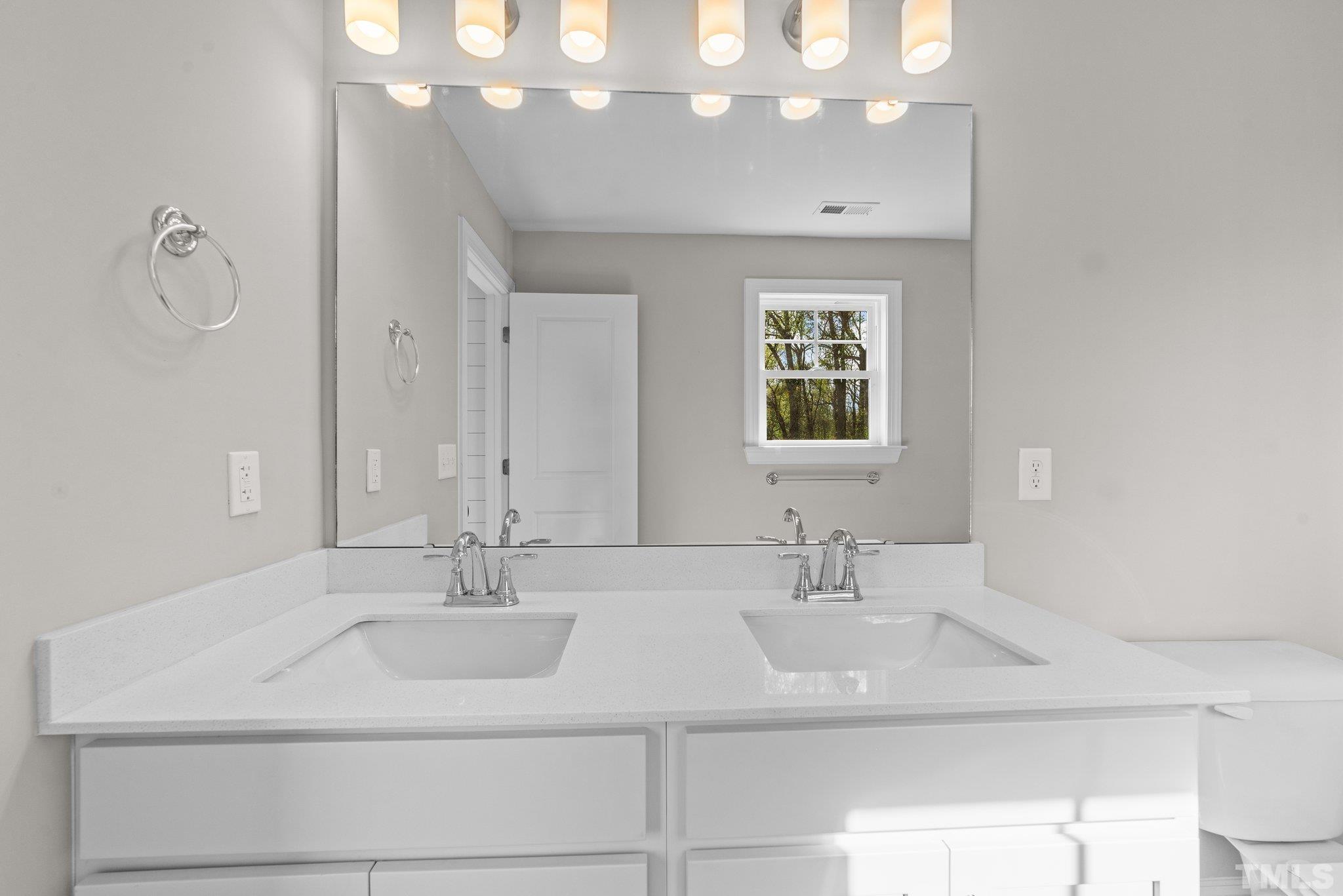 4530 Fairhaven Drive Wilson, NC 27893 - Photo 21 of 49 a bathroom with a sink and a mirror