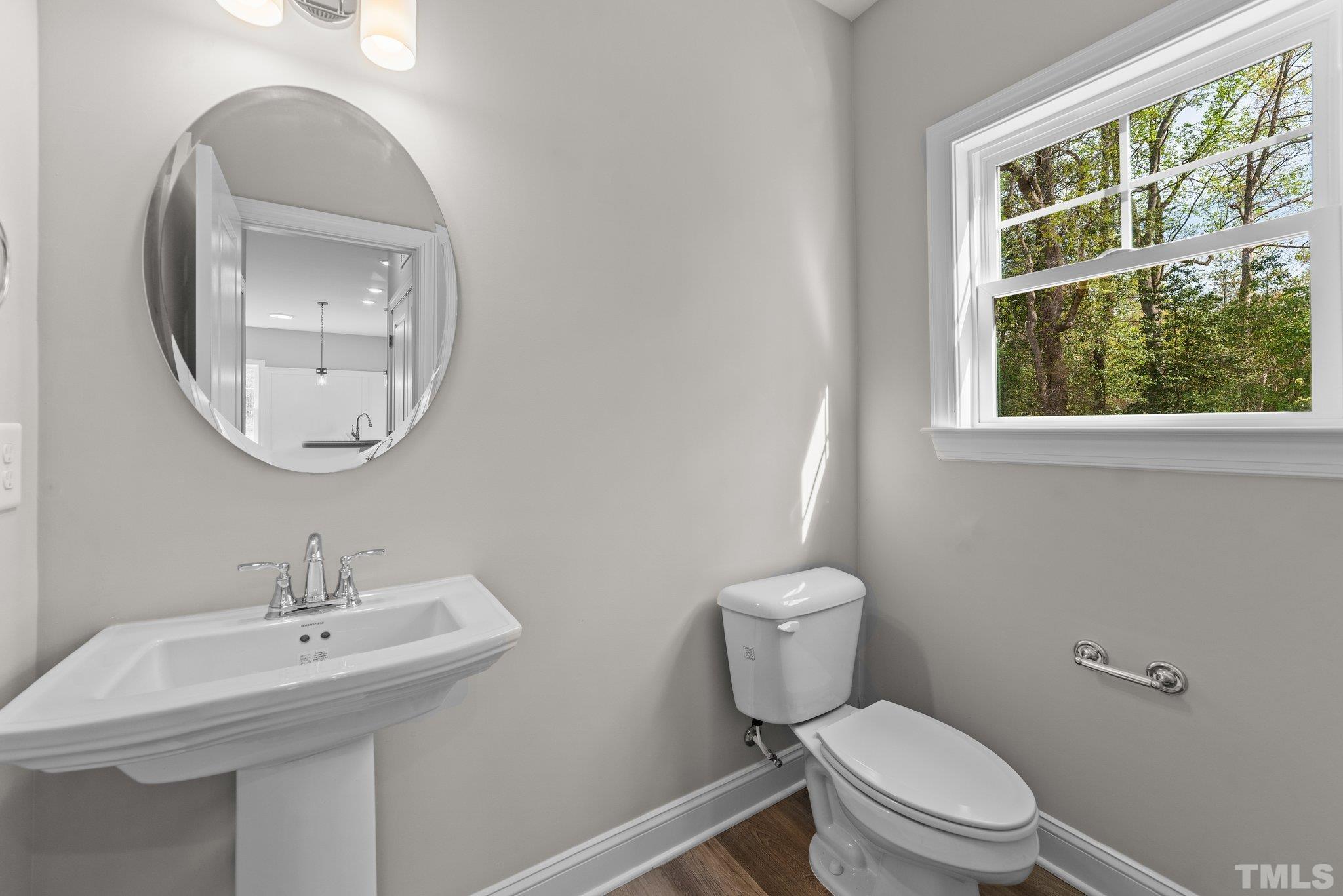 4530 Fairhaven Drive Wilson, NC 27893 - Photo 25 of 49 a bathroom with a toilet a sink and a mirror