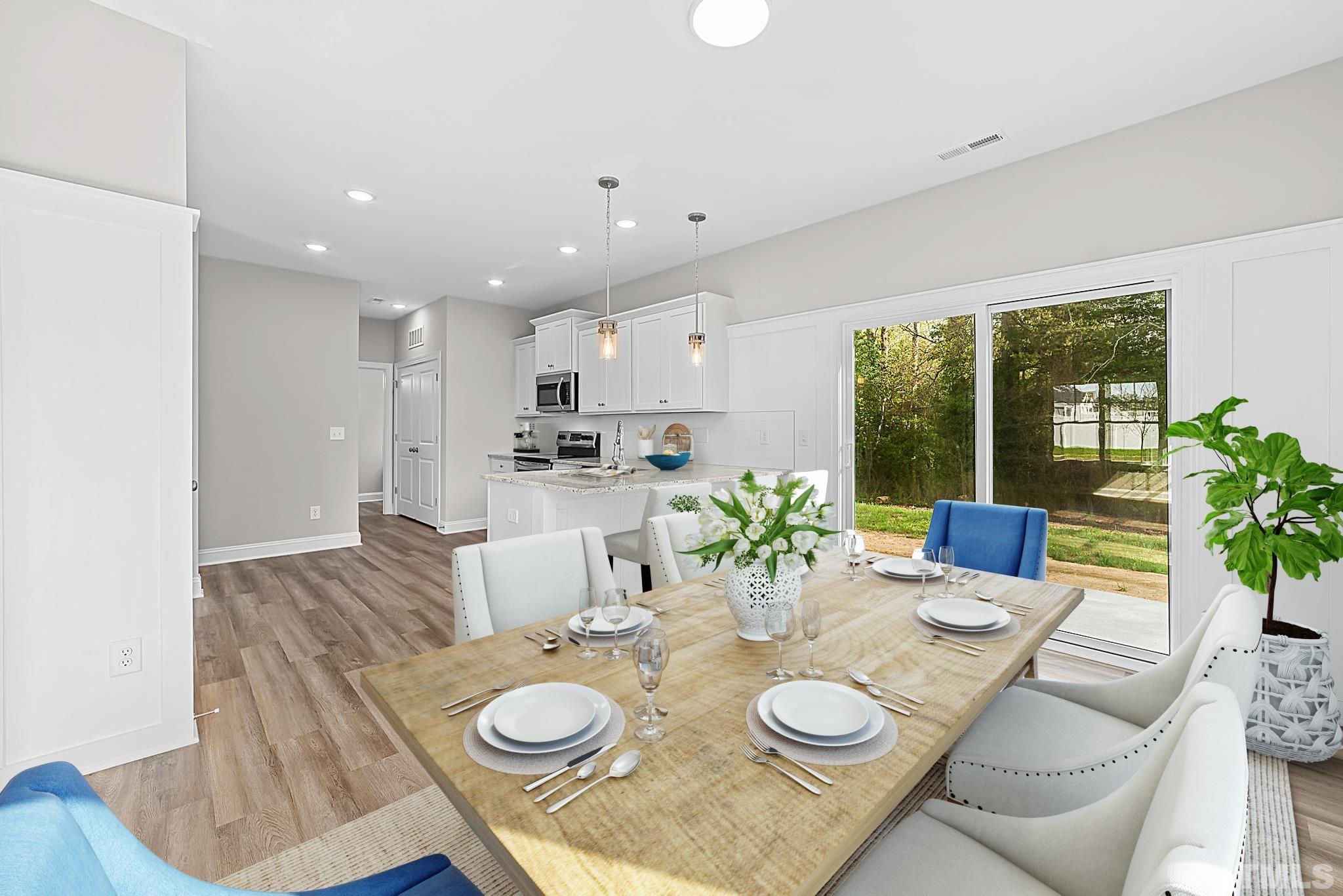 4530 Fairhaven Drive Wilson, NC 27893 - Photo 4 of 49 a view of a dining room with furniture wooden floor and a potted plant