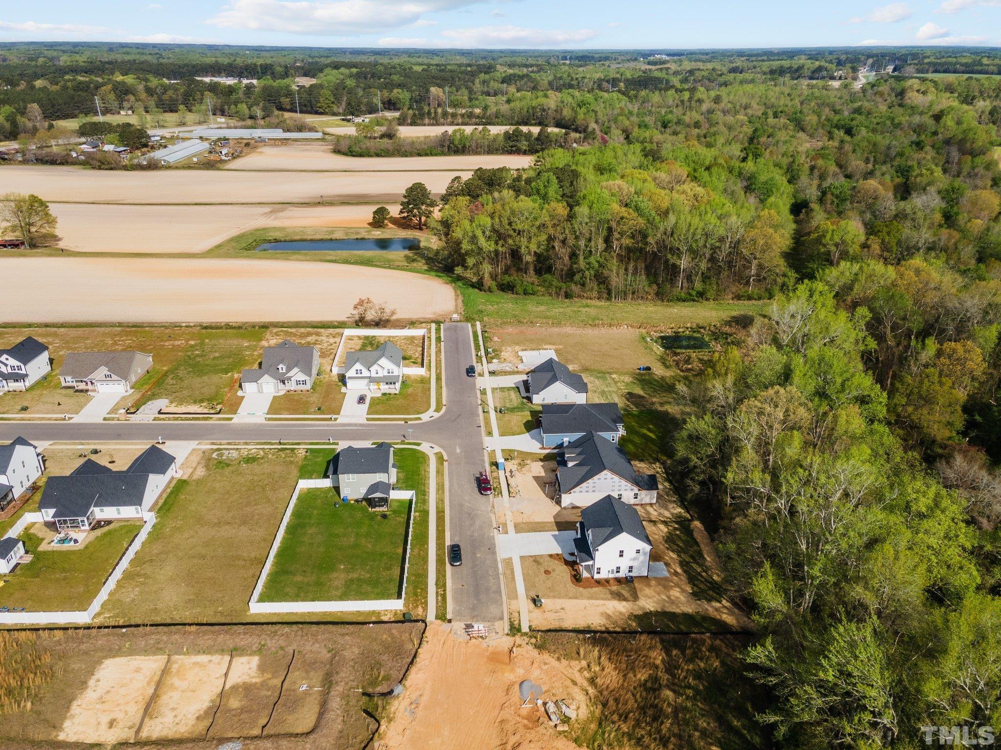 4530 Fairhaven Drive Wilson, NC 27893 - Photo 46 of 49 an aerial view of residential houses with outdoor space