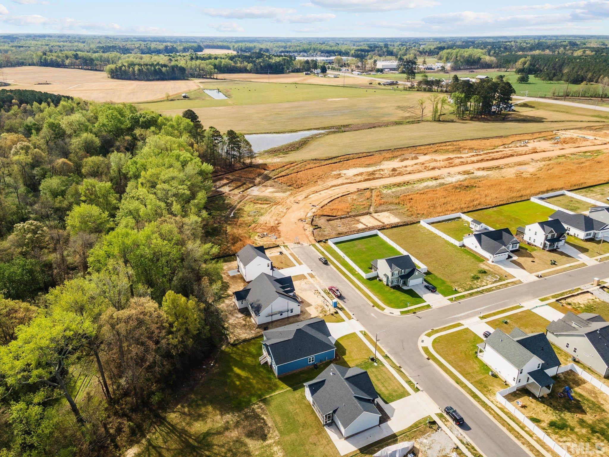 4530 Fairhaven Drive Wilson, NC 27893 - Photo 48 of 49 an aerial view of residential houses with outdoor space and ocean view
