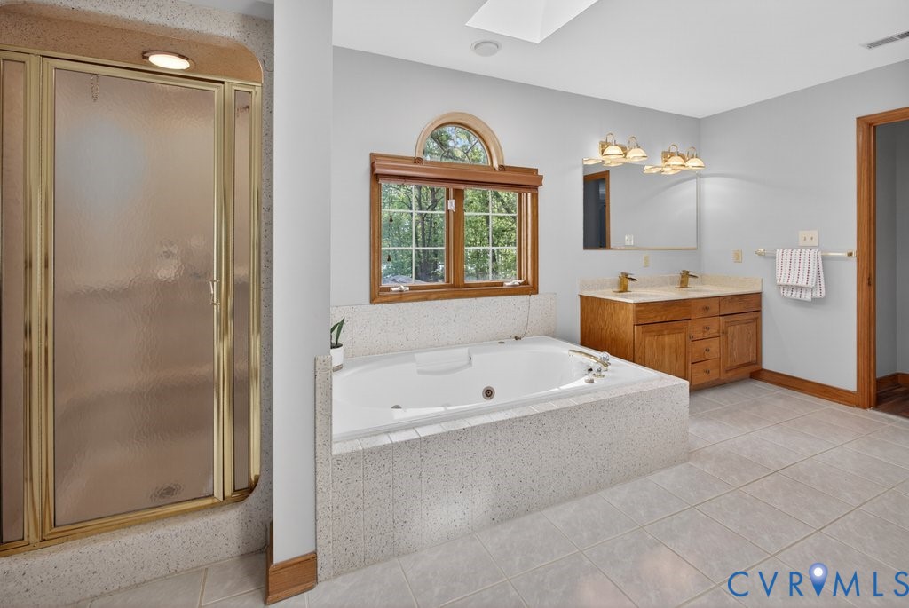 173 Covenant Way Bumpass, VA 23024 - Photo 34 of 63 The bathroom features a built-in tub, a separate s